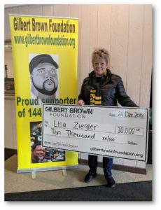 Lisa Zigler holding check